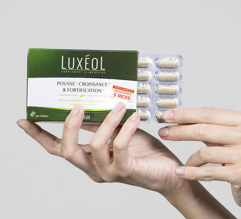 Luxéol capsules box in hand – 3‑month growth, density, strength program.