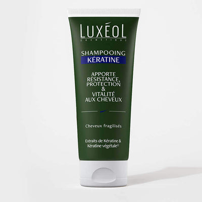 Luxéol Keratin Shampoo 200 ml tube on minimal background for fragile hair strength and vitality.