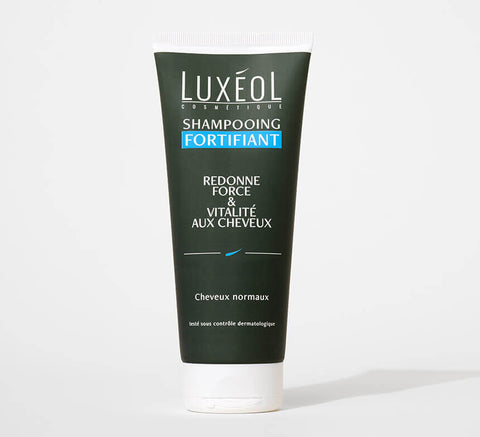 Luxéol Strengthening Shampoo 200 ml tube on minimal background for strength and vitality.