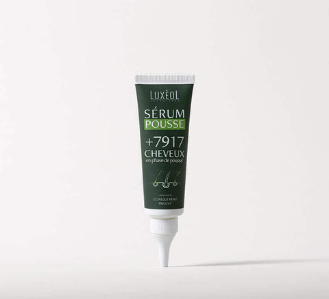 Green tube of Luxeol Serum Pousse on a white background