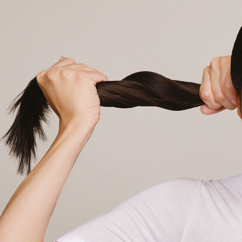 Women holding her hair strong