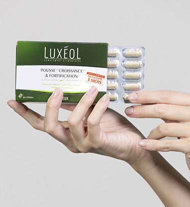 supplement in hand for hair growth and density