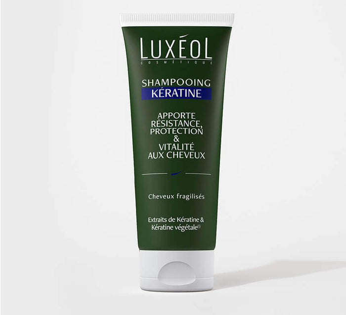 Luxéol Keratin Shampoo 200 ml tube on minimal background for fragile hair strength and vitality.