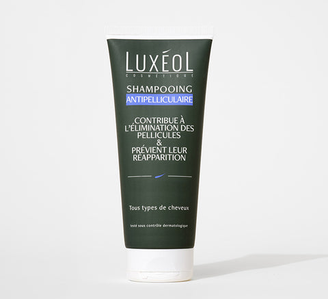 Shampoo agains dandruff on white background